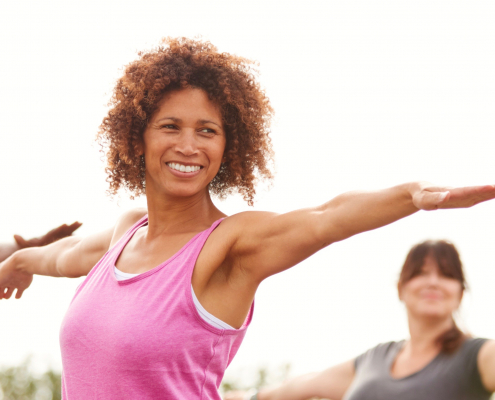 Outdoor excersie class of smiling people